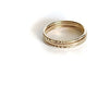 Gold rings on a white background
