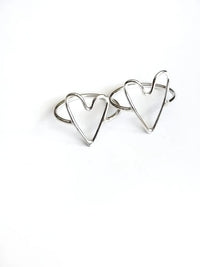 Two heart shaped rings on a white background.
